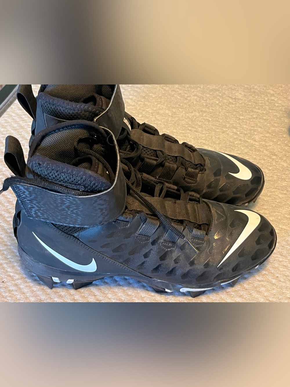 Nike Men’s Black High-Top Football Cleats with White Swoosh